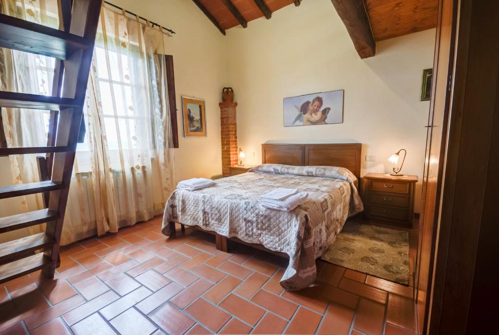 A bed or beds in a room at Agriturismo San Francesco