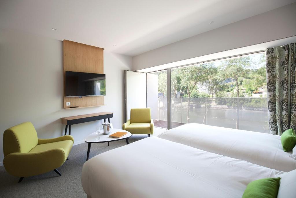 Postel nebo postele na pokoji v ubytování Best Western Plus Hotel Divona Cahors