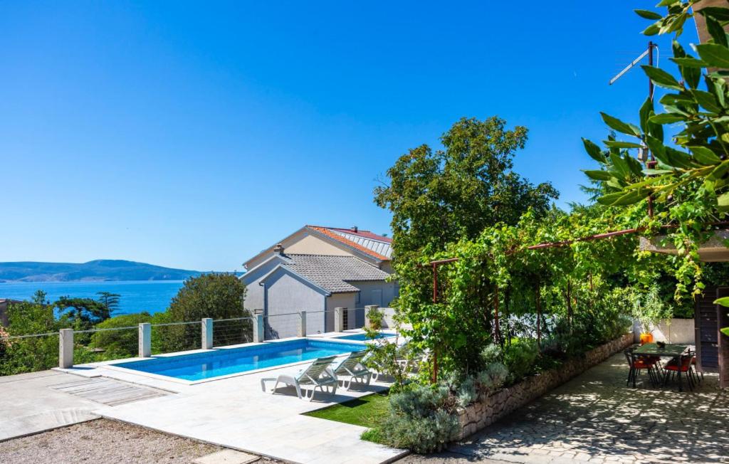 a villa with a swimming pool and a house at Villa Nina with pool - Kvarner by Villas Guide in Novi Vinodolski