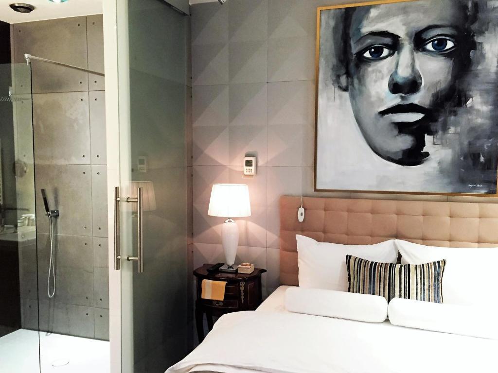 Postel nebo postele na pokoji v ubytování MONDRIAN Luxury Suites & Apartments Old Town