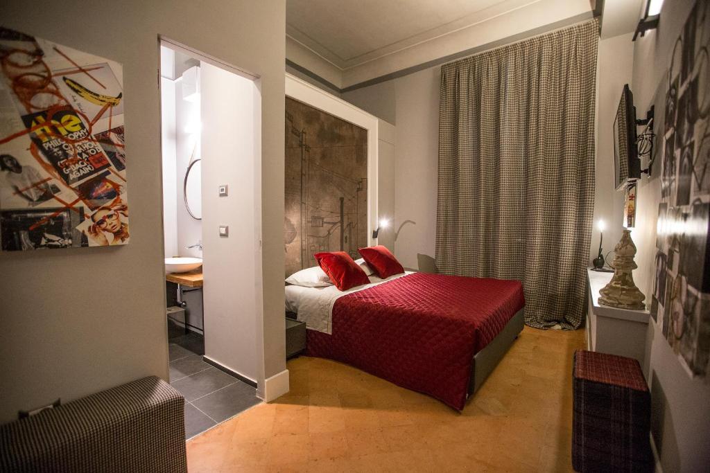 Łóżko lub łóżka w pokoju w obiekcie Palazzo Cannavina Suite & Private SPA
