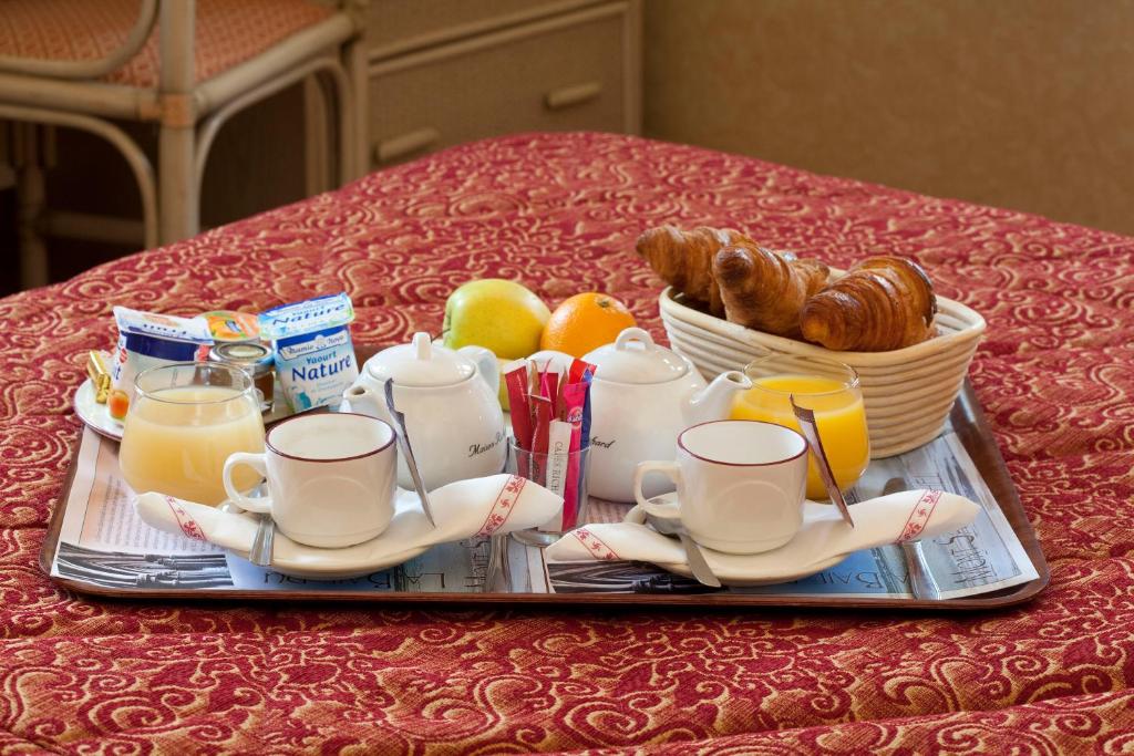 a tray with a tray of breakfast food on a table at Auberge Saint Pierre in Le Mont Saint Michel