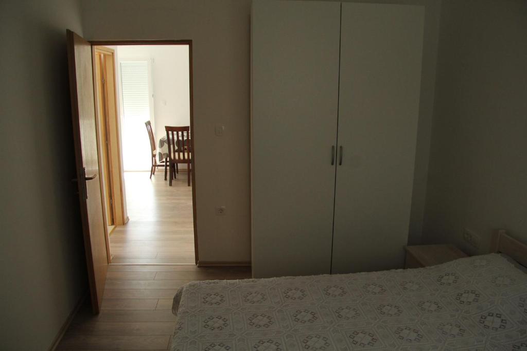 Postel nebo postele na pokoji v ubytování Bed & Breakfast Novalja Inn