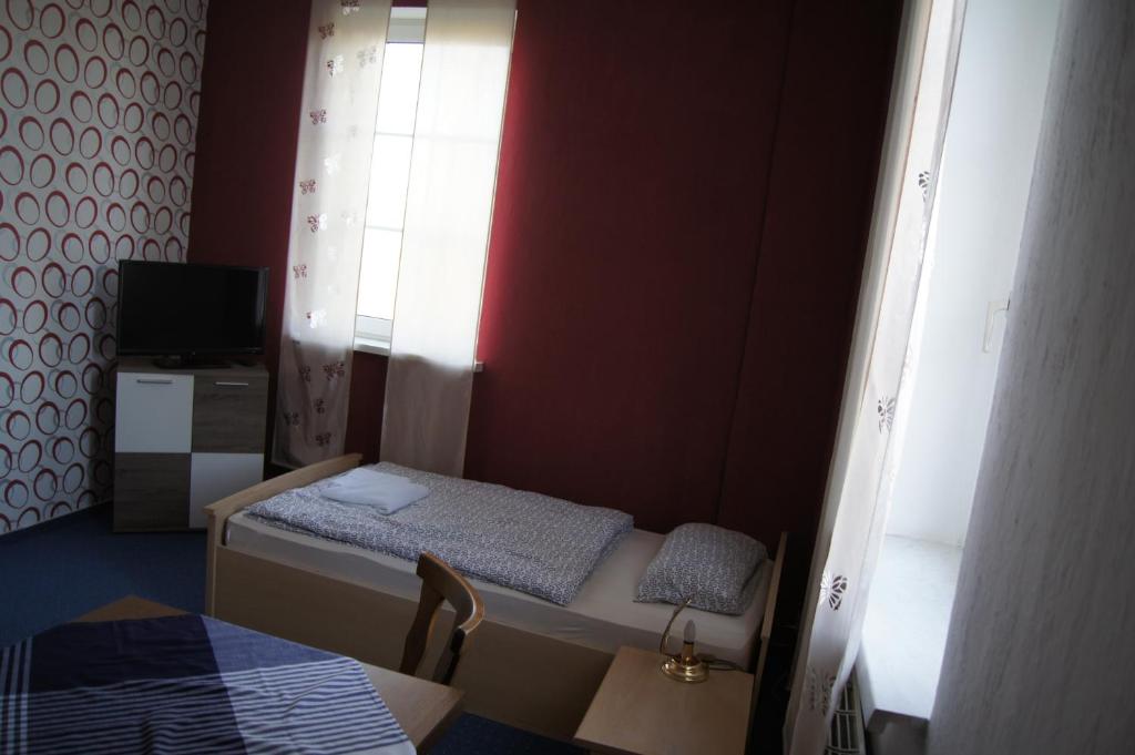 Postel nebo postele na pokoji v ubytování Hotel Draschwitz