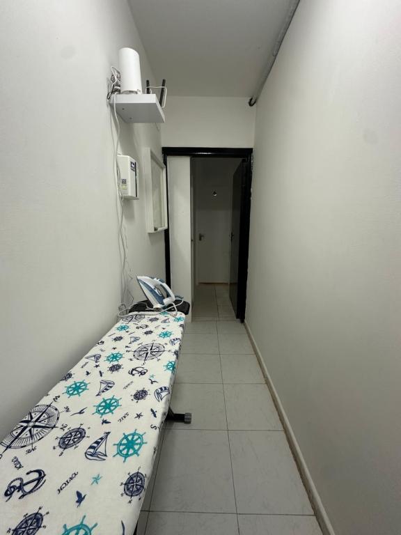 a hospital room with a bed in a corridor at Private double Delight Couple Room in Abu Dhabi