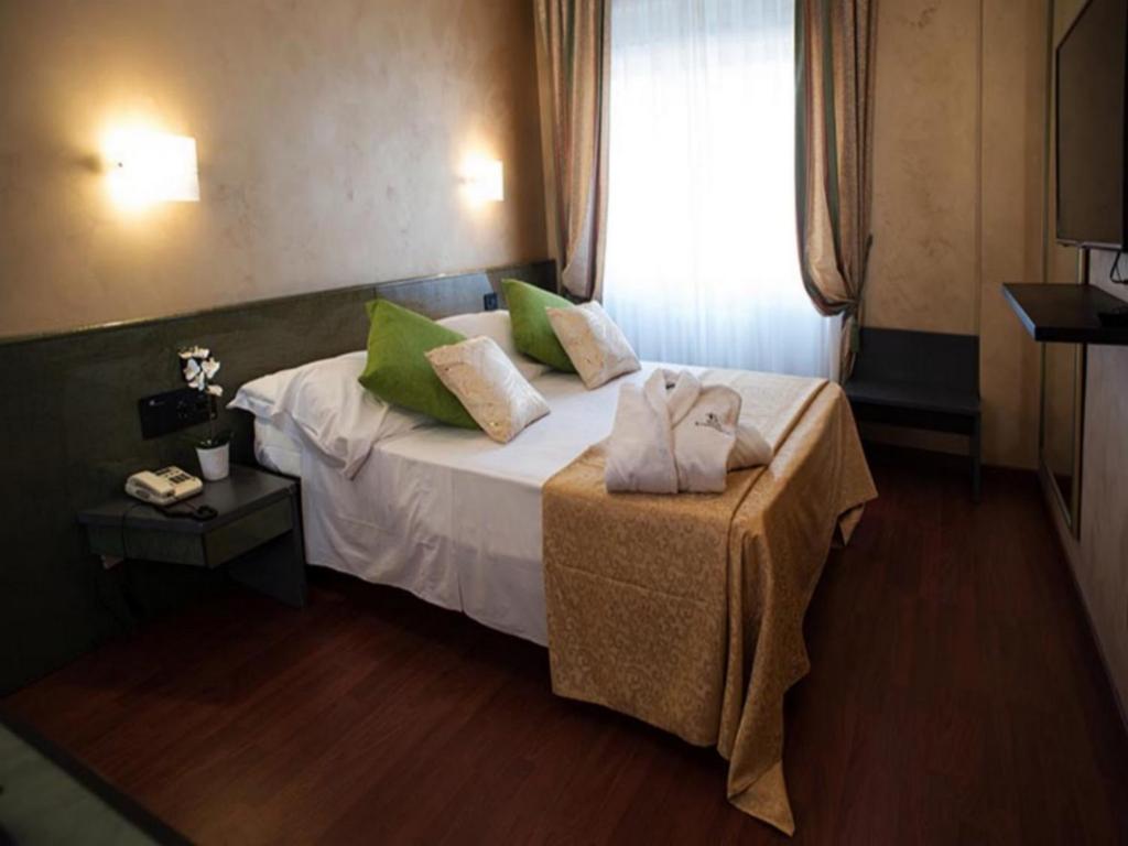 Postel nebo postele na pokoji v ubytování Hotel il Castelletto