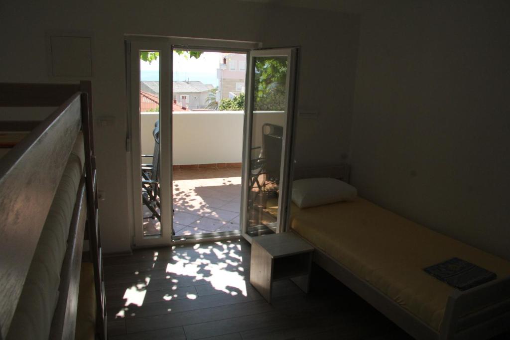 Postel nebo postele na pokoji v ubytování Bed & Breakfast Novalja Inn