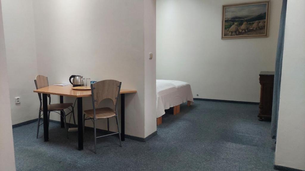 Ένα ή περισσότερα κρεβάτια σε δωμάτιο στο Penzion TGM