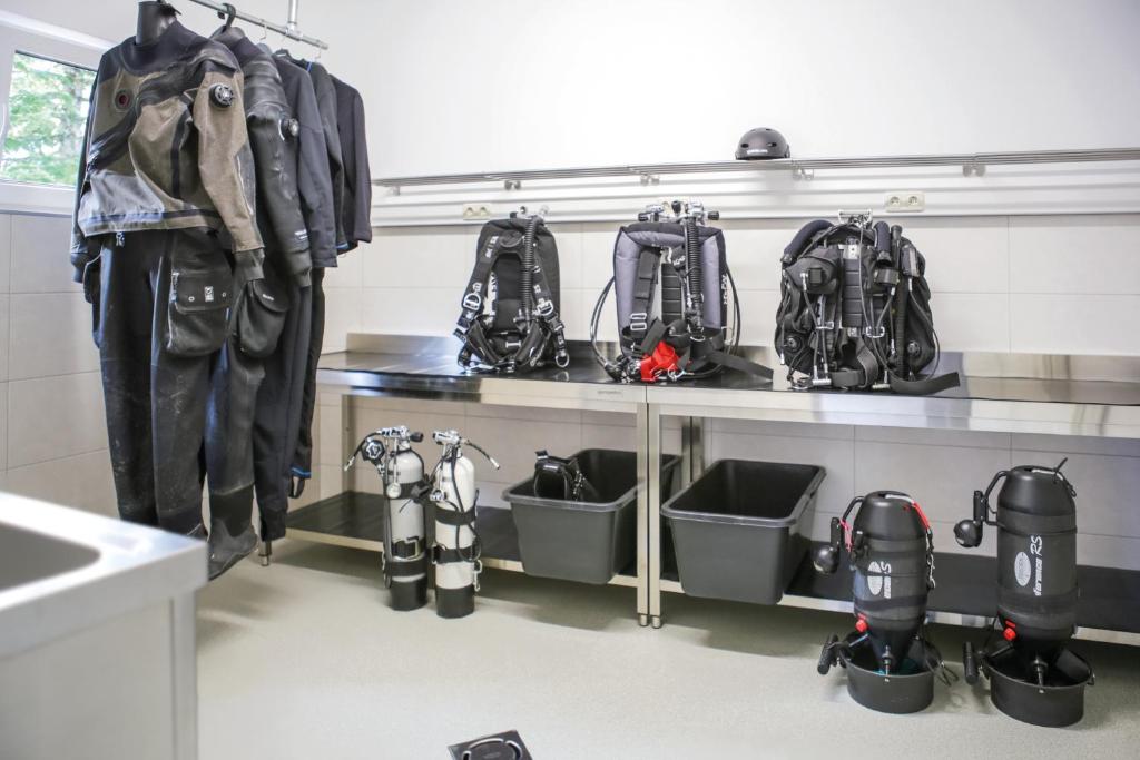 a room with a bunch of backpacks on a shelf at Haslbauer in Steinbach am Attersee