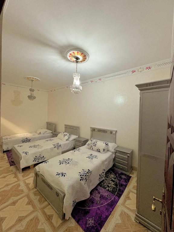 Ένα ή περισσότερα κρεβάτια σε δωμάτιο στο Apartamento con 3 habitaciones ROOMS