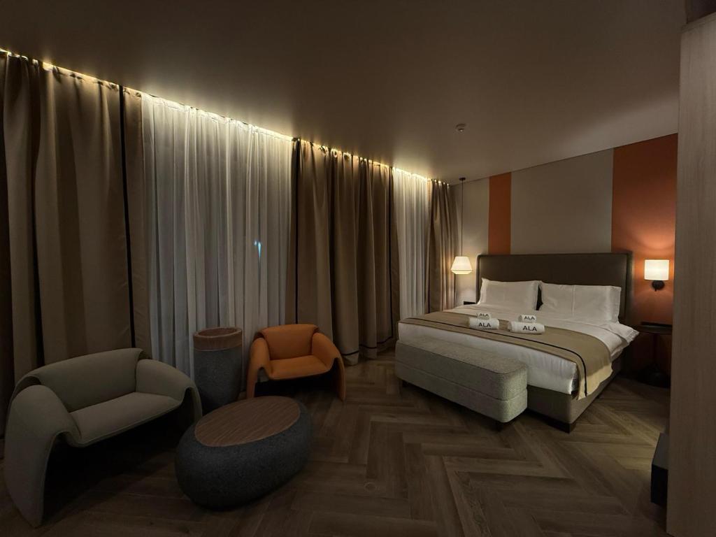 Кровать или кровати в номере Ala Boutique Hotel