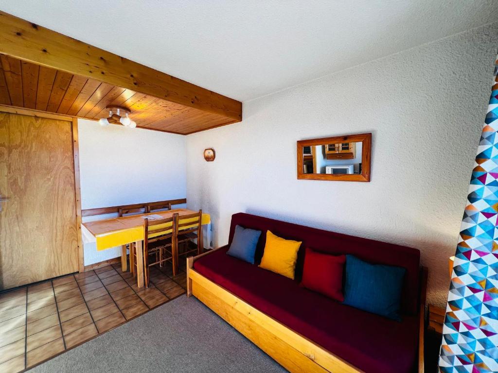 a living room with a couch and a table at Studio Cabine Les Saisies, 4 pers, Terrasse sud - FR-1-293-413 in Les Saisies