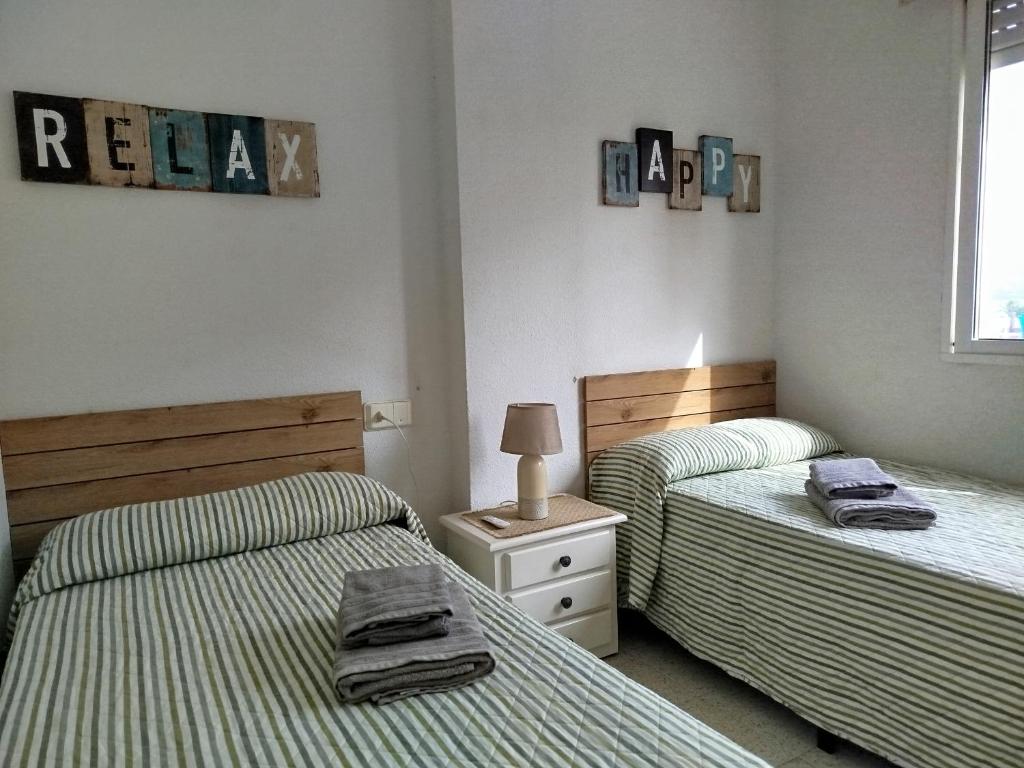 Postel nebo postele na pokoji v ubytování Apartamento Gran Sol cerca de la playa en La Manga