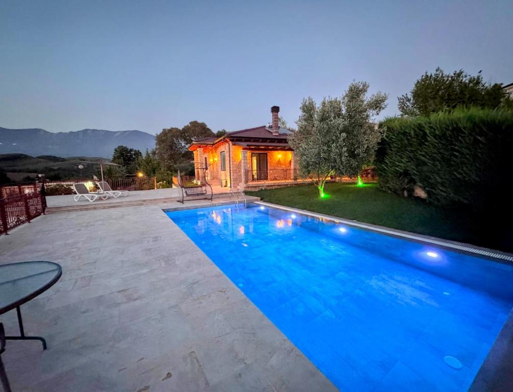 a swimming pool in the backyard of a house at Green Garden Villa & Pool in Tirana