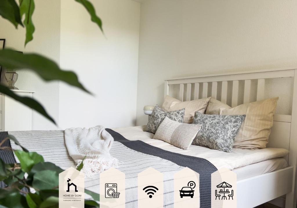 Ένα ή περισσότερα κρεβάτια σε δωμάτιο στο Home by Doni I Apartment an der Kunsthalle I Parkplatz & Balkon