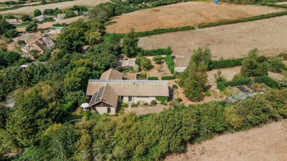 an aerial view of a house on a hill at Underhill in Corfe Castle