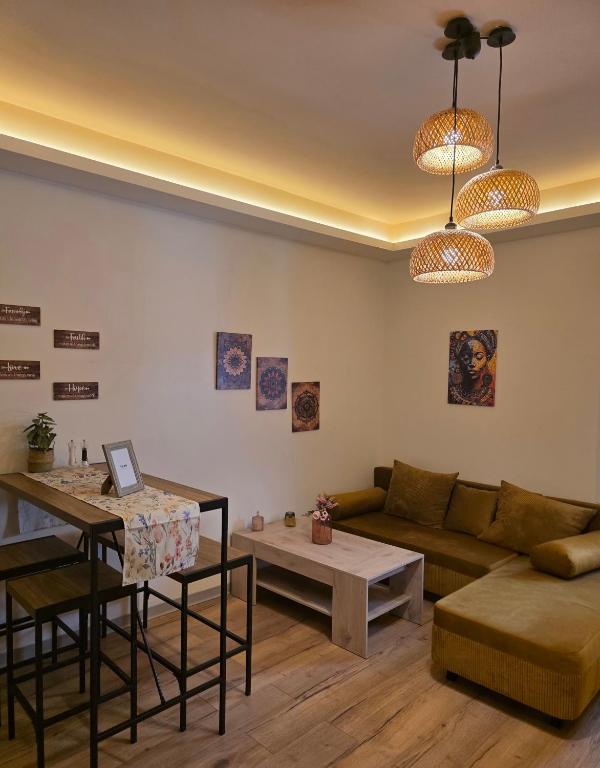 a living room with a couch and a table at Kos central vibes - Casa Vasilis in Kos