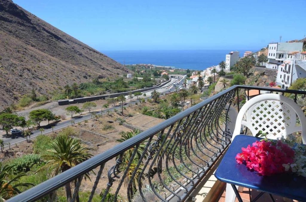 a balcony with a table and a view of a street at Gran Rey n4 in Valle Gran Rey
