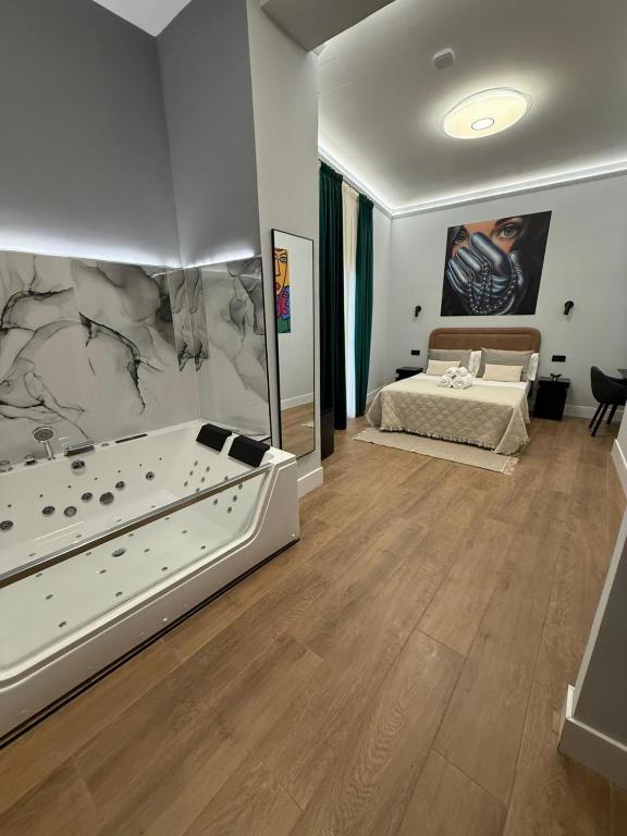 a large room with a bed and a bathroom at Ventura Luxury in Alicante