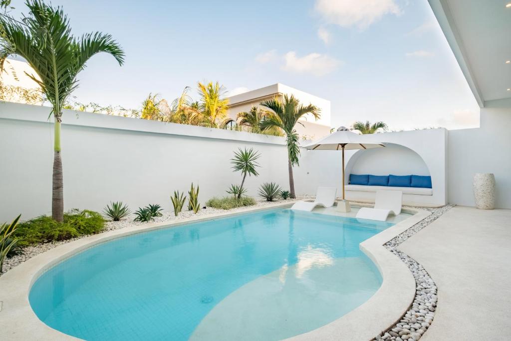 a swimming pool in the backyard of a villa at Ocean Verve Villa 1 in Uluwatu
