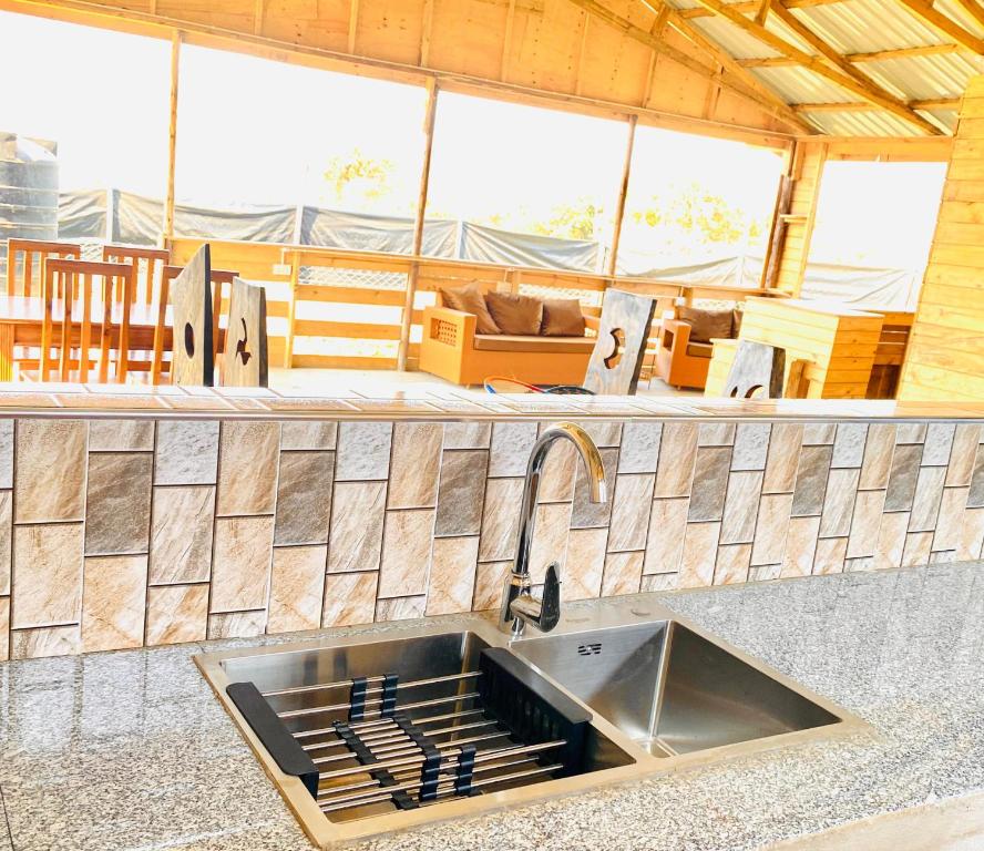 a kitchen with a sink in a counter top at Twende Home lodge in Arusha