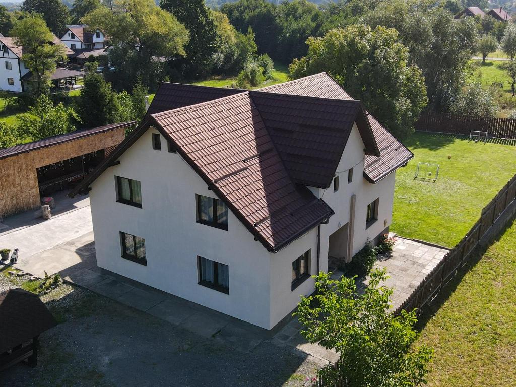 an overhead view of a white house with a roof at Casa Nicoleta in Bran