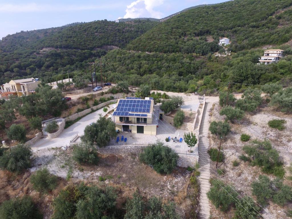 an aerial view of a house with solar panels on it at Sivota Apartments in Syvota