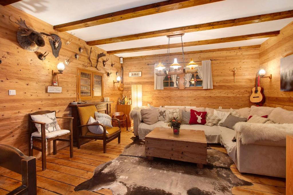 a living room with a couch and a table at Zähringer Hütte in Menzenschwand-Hinterdorf