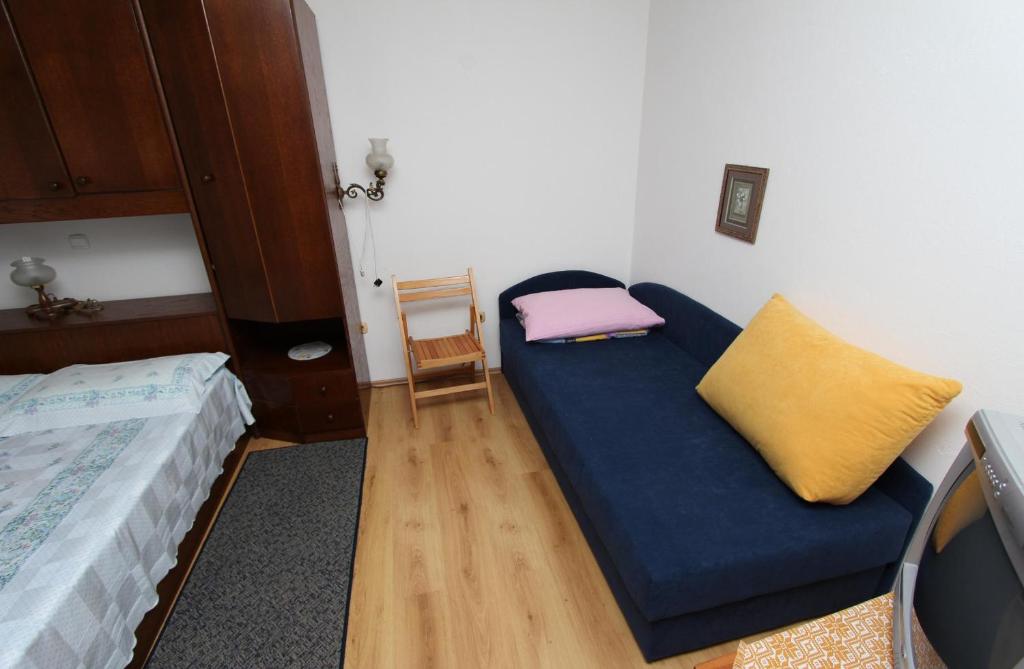 Łóżko lub łóżka w pokoju w obiekcie Apartments Rosanna