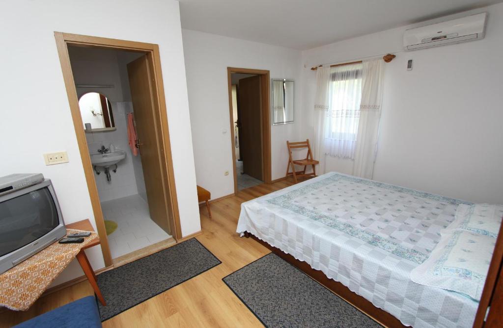 Łóżko lub łóżka w pokoju w obiekcie Apartments Rosanna