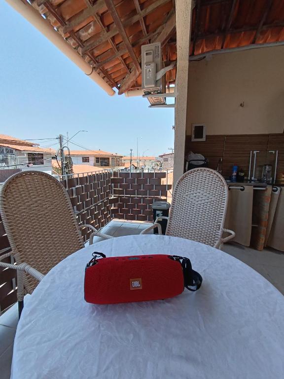 a red bag sitting on top of a table at Apartamento downtown in Beberibe