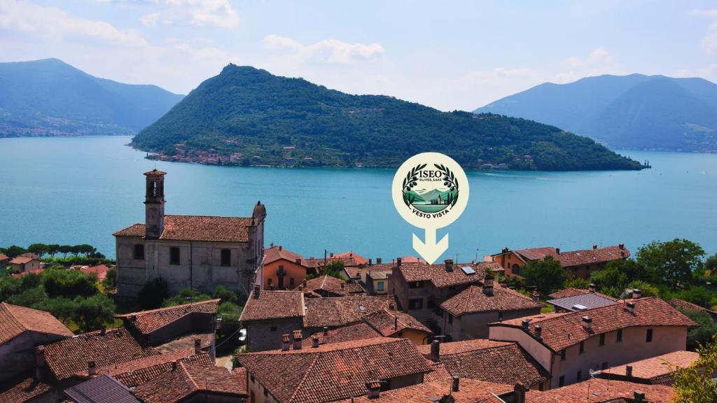a view of a town with a lake and mountains at Vesto VISTA in Marone