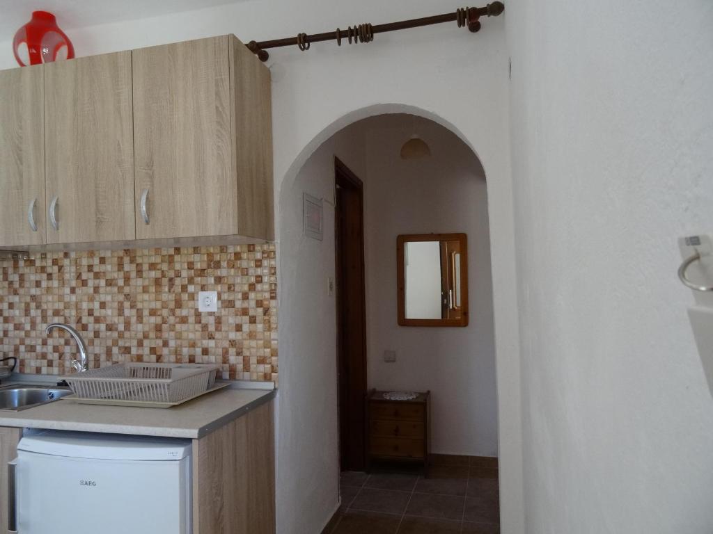 a kitchen with a sink and a counter top at House Anna Houhlia in Vourvourou