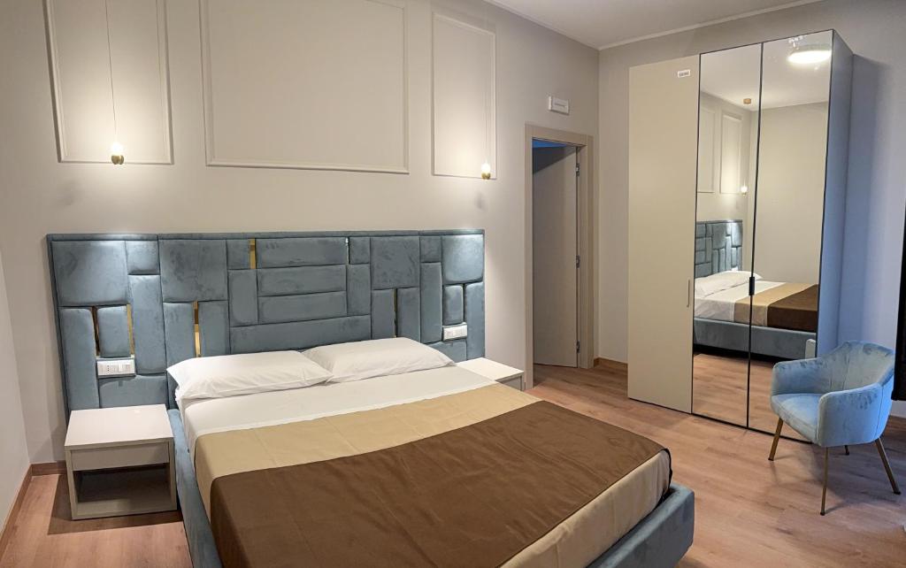 Ένα ή περισσότερα κρεβάτια σε δωμάτιο στο Ludey B&B Reggio Calabria