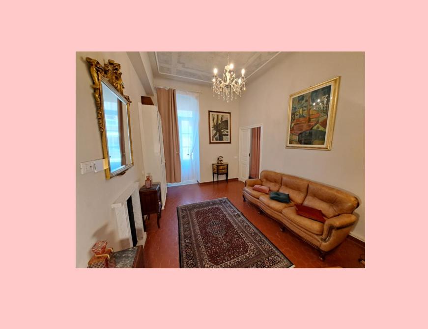 a living room with a couch and a fireplace at CAVOUR257 in La Spezia