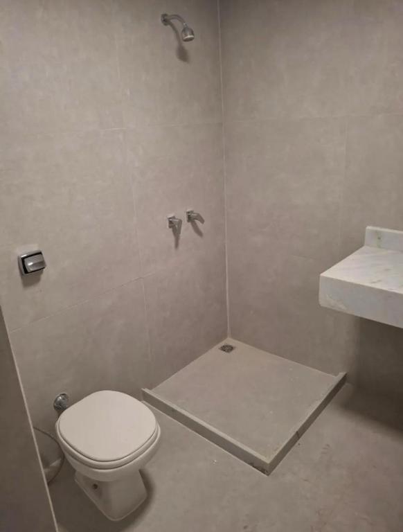 a bathroom with a toilet and a sink at Pousada da Lili e do Zé in Rio de Janeiro