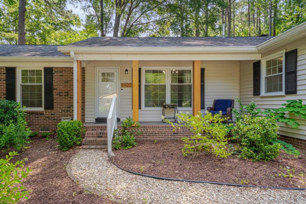 a house with a front porch with a door at Relaxing Retreat Near North Hills & Downtown home in Millbrook
