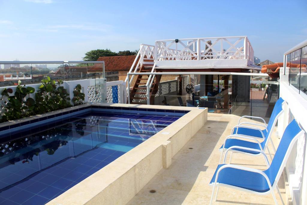 a swimming pool on the roof of a house at Casa Villa Colonial By Akel Hotels in Cartagena de Indias