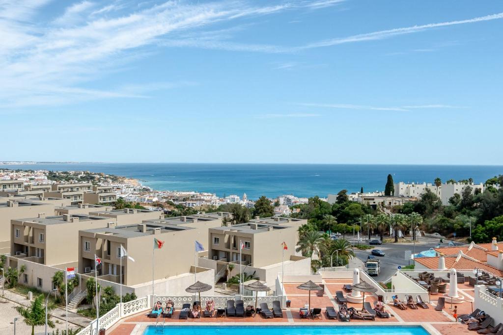 an aerial view of a resort with a swimming pool at Bellavista Jardim By BeGuest in Albufeira