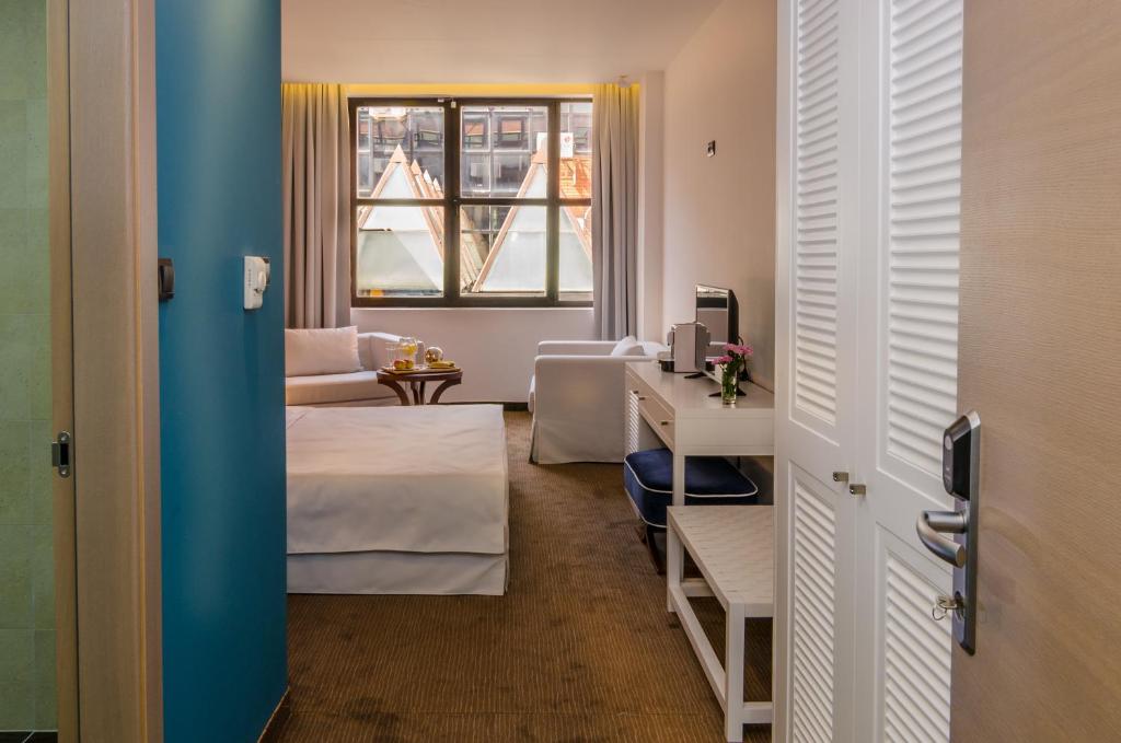 Postel nebo postele na pokoji v ubytování Hotel Passport