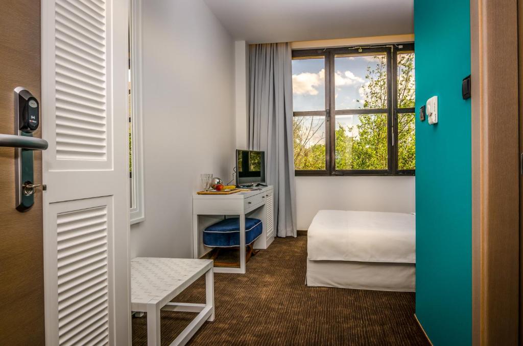 TV a/nebo společenská místnost v ubytování Hotel Passport