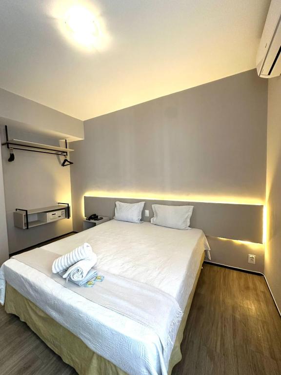 Postel nebo postele na pokoji v ubytování 1155 golden 55m2 1 quarto frente mar avenida beira mar