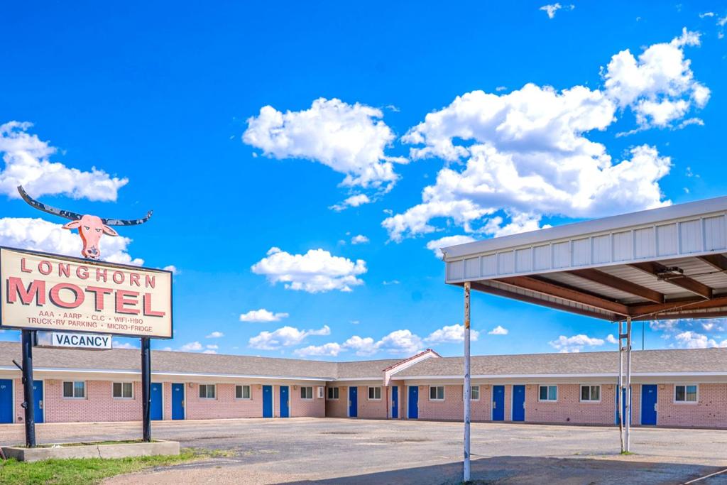 a motel sign in front of a motel at Hotel O Longhorn Boise City OK in Boise City