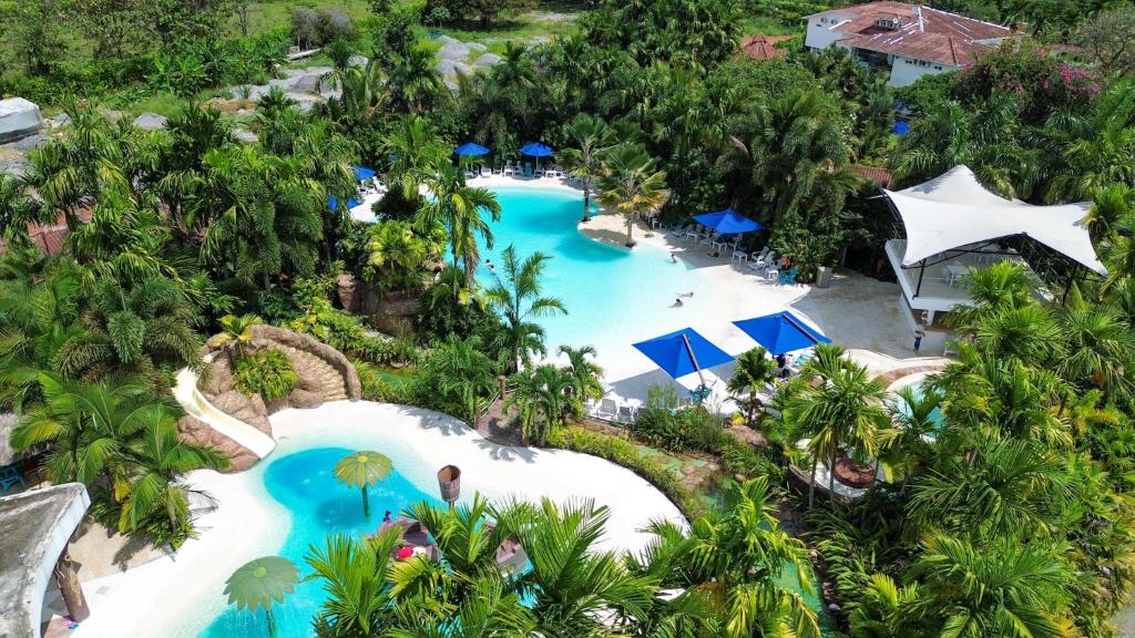 an overhead view of a pool at a resort at Hotel Playa Maui in Guamal
