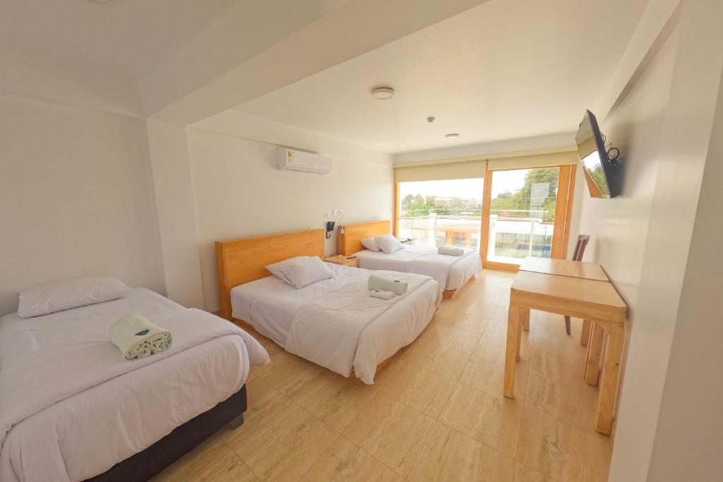 Ένα ή περισσότερα κρεβάτια σε δωμάτιο στο Hotel Boutique La Angostura II