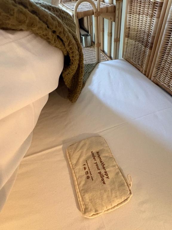 a small item is sitting on a bed at Nikiti Blue house 30m from the beach with sea view in Nikiti