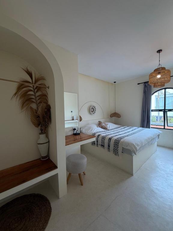 Ένα ή περισσότερα κρεβάτια σε δωμάτιο στο Villa Bambu