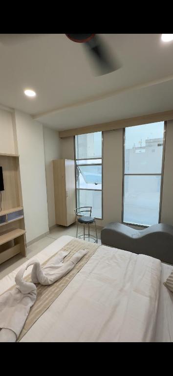 Postel nebo postele na pokoji v ubytování Hotel Sky Gold