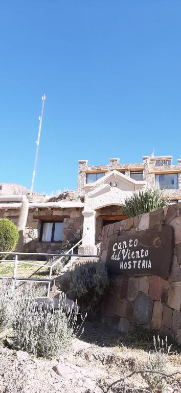 a building with a sign in front of it at canto del viento in Tilcara