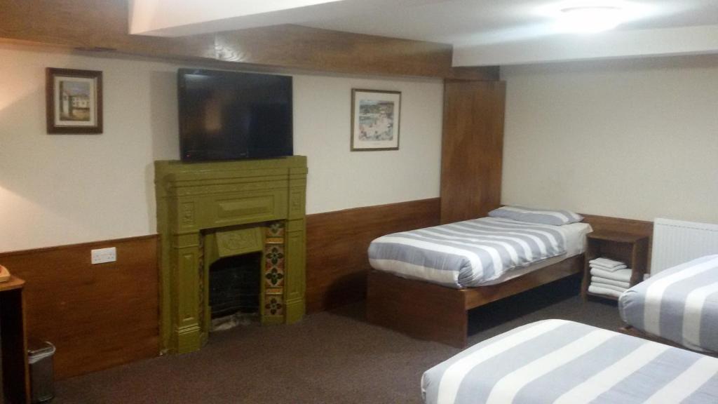 Cama o camas de una habitación en Adelphi Hotel